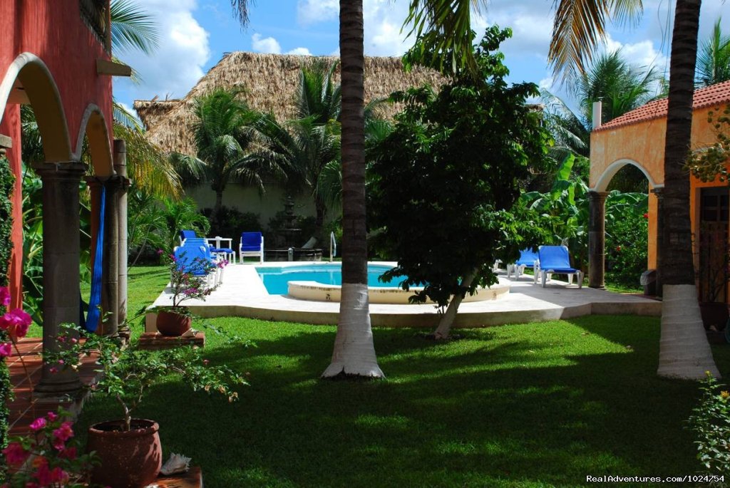 Our pool is surrounded by a lush tropical garden | Casa Colonial, Cozumel Vacation Villas | Image #2/8 | 