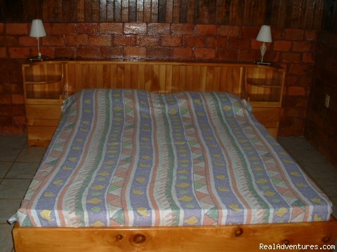 Estrella de Paraiso Private Nature Reserve: rustic style bedroom with queen size bed