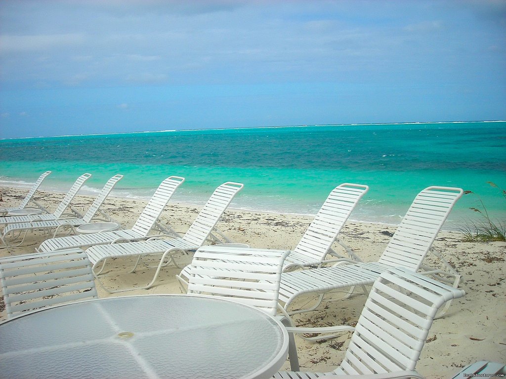 Chaise Lounges & Chairs Provided Overlooking the Ocean | Oceanfront Villa on Grace Bay Beach | Image #6/24 | 
