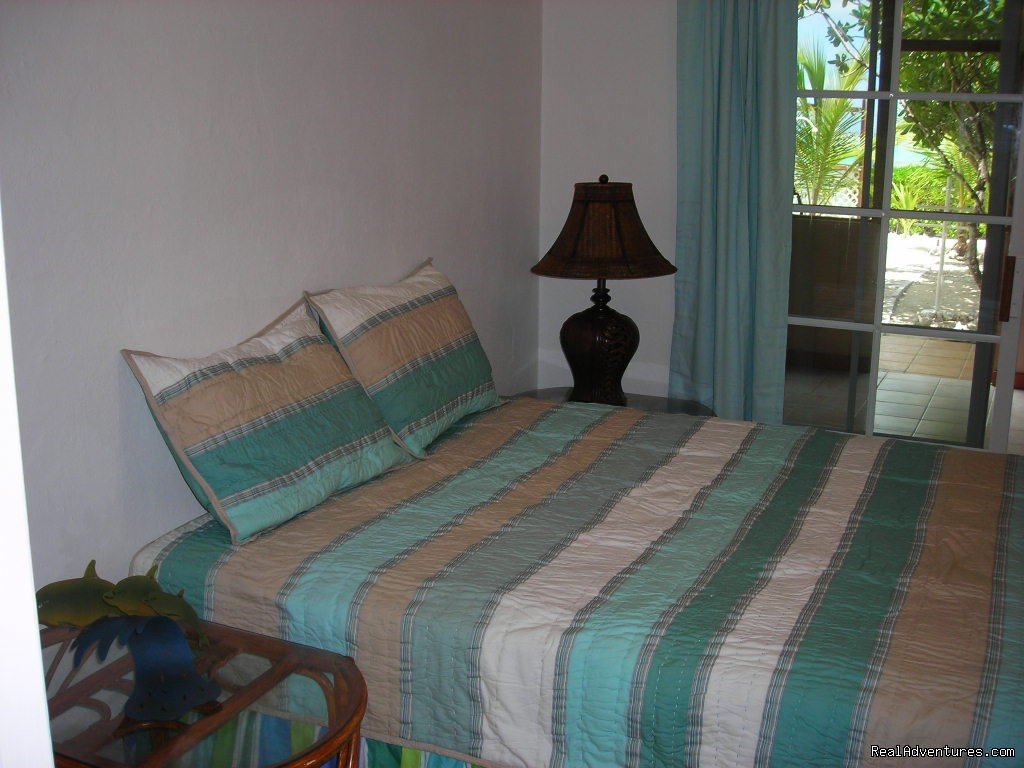 Queen Size Bedroom Faces the Ocean-1st Floor | Oceanfront Villa on Grace Bay Beach | Image #20/24 | 