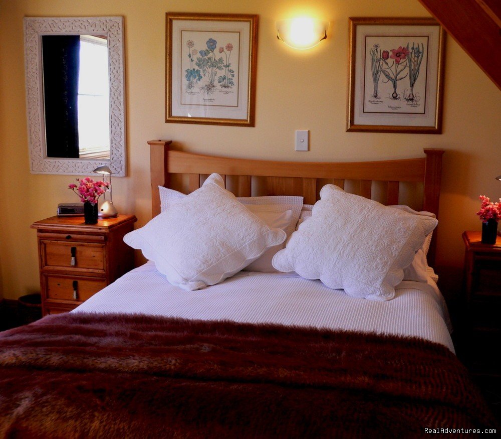 Upstairs queen bedroom | Romantic NZ country cottage: 5-Star B&B  Waitomo | Image #3/15 | 