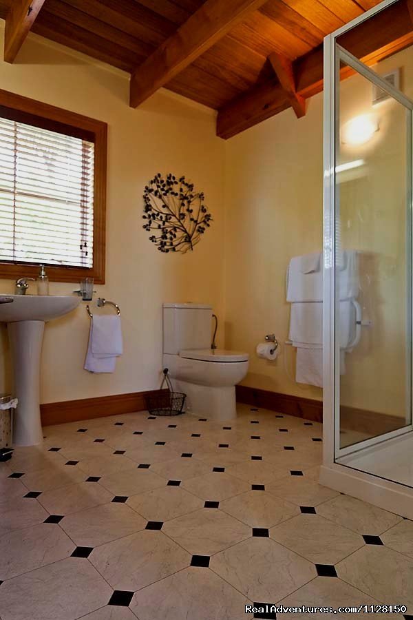 bathroom downstairs | Romantic NZ country cottage: 5-Star B&B  Waitomo | Image #5/15 | 