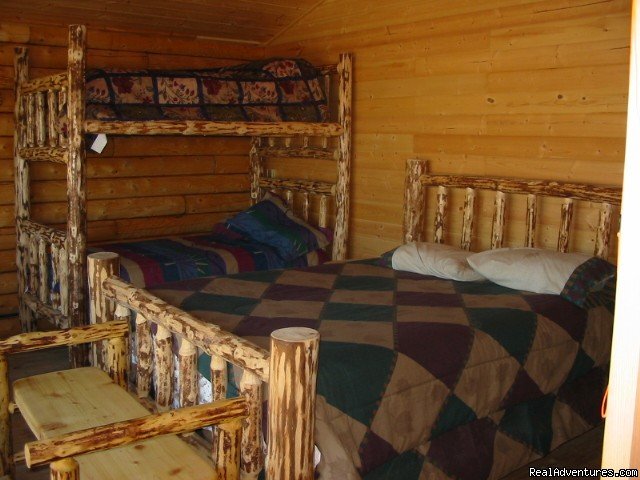 one of our log furnished rooms | Relax in Solitude In Rustic Cabin Bed & Breakfast | Image #4/6 | 