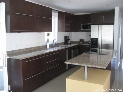 Ocean Villa 2 blocks from the beach in San Juan: Granite Covered Kitchen with Stainless Steel Appliances