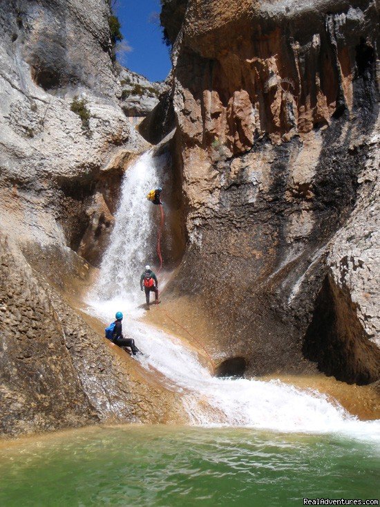 Abseil and tobogan in a canyon | Canyoning And Adventure In Sierra De Guara - Spain | Las Almunias de Rodellar, Spain | Hiking & Trekking | Image #1/6 | 