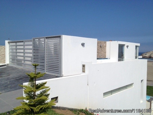 Main Entrace, 2 car garage and utility space. | Brand New Beachfront House - Peru (Las Palmeras) | Image #6/8 | 