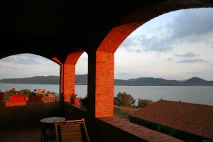 Romantic and relax sunset on the island  | italy umbria, Italy | Bed & Breakfasts