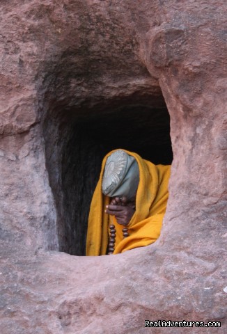 Nun praying in Bet Georgis - Lalibela - Edenland Tour and Travel Ethiopia - ethiopia ethiopia sight-seeing tour addis ababa