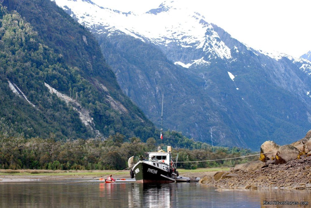 Cahuelmo support boat  | kayaking  Pumalin Park  Andean fjords Patagonia | Image #4/4 | 
