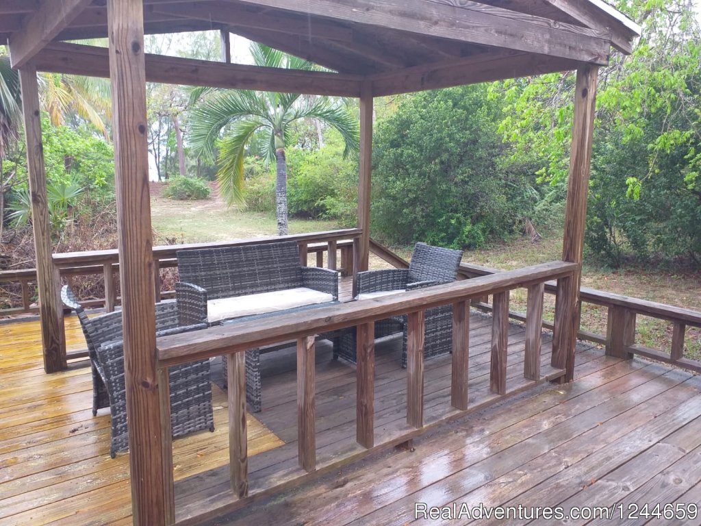 Large Deck with dinining area and gas grill | Charming 2Bed/2Bath Cottage On Secluded Pink Sand | Image #5/13 | 