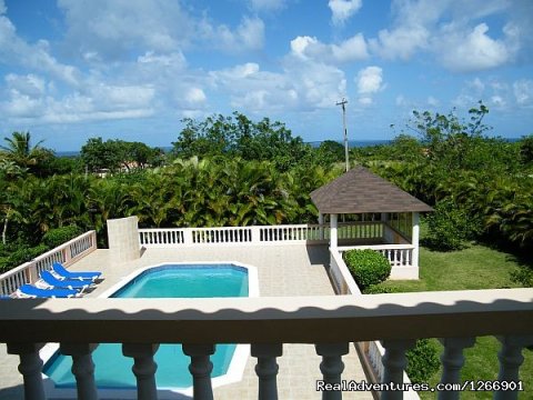 Guest suite Balcony ocean, pool, & garden view