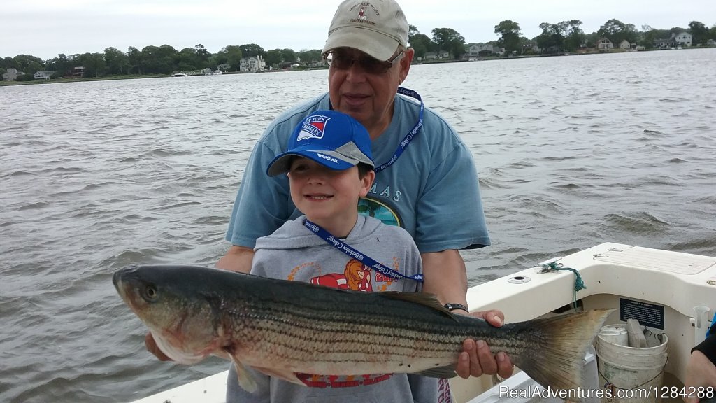 8 Yr Old Kyle With Nice Striper | D.c. Outdoor Adventures | Image #22/26 | 