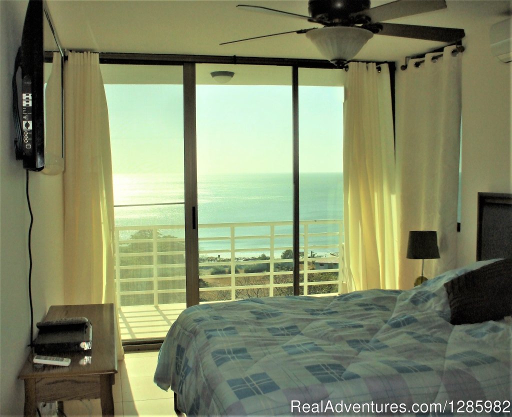 Master Bedroom with balcony overlooking ocean | Ocean View 2 bed/2 bath apt with pool in Gorgona | Image #5/7 | 